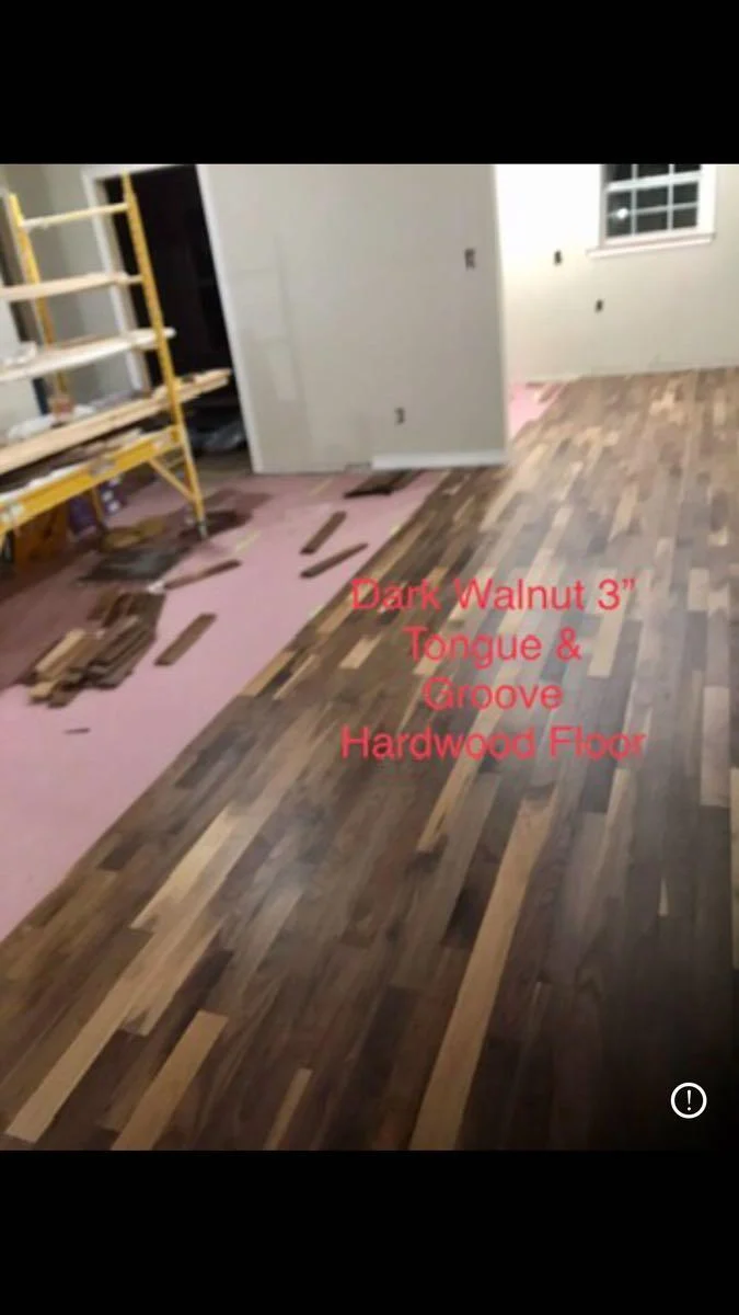 Wood-look flooring being installed in an interior room