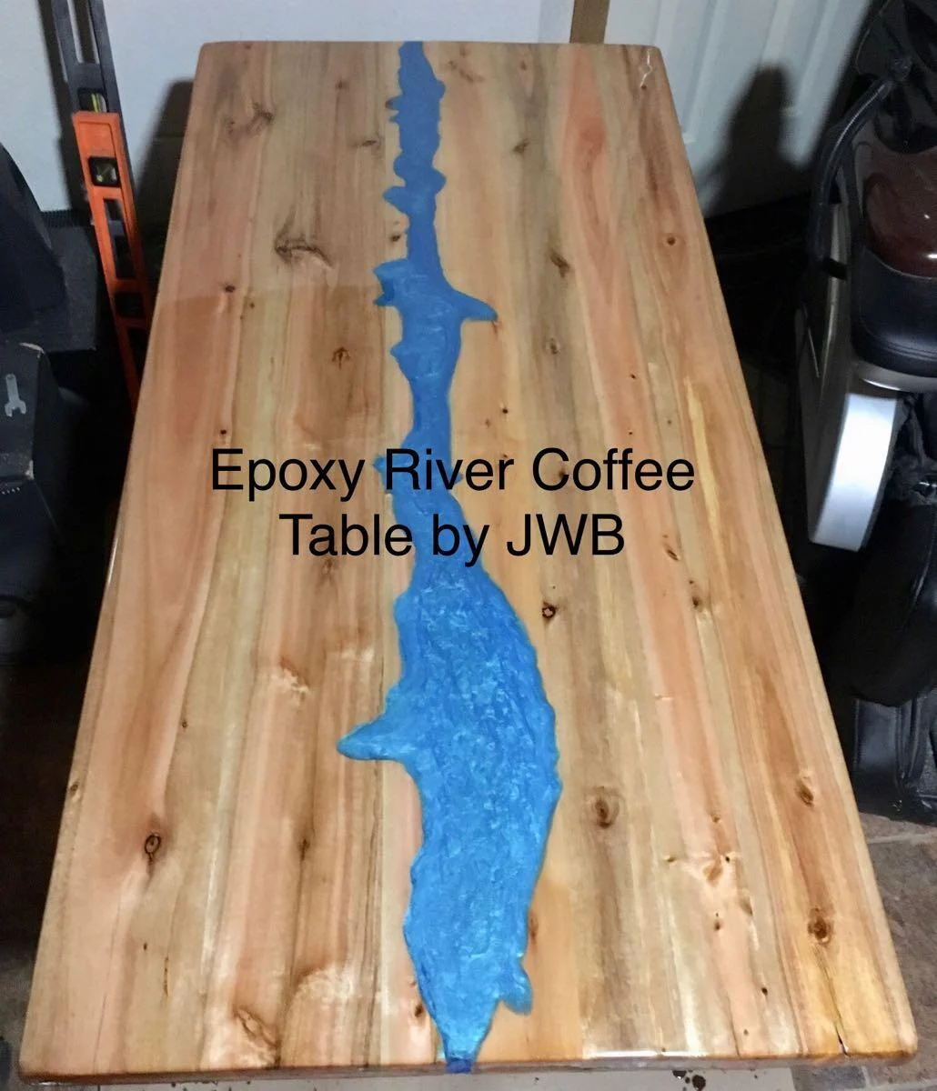 Handmade wood coffee table with a blue epoxy river